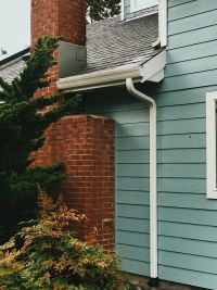 new copper downspout and seamless gutter installation