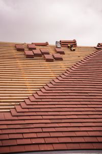 clay tile roof installation in progress